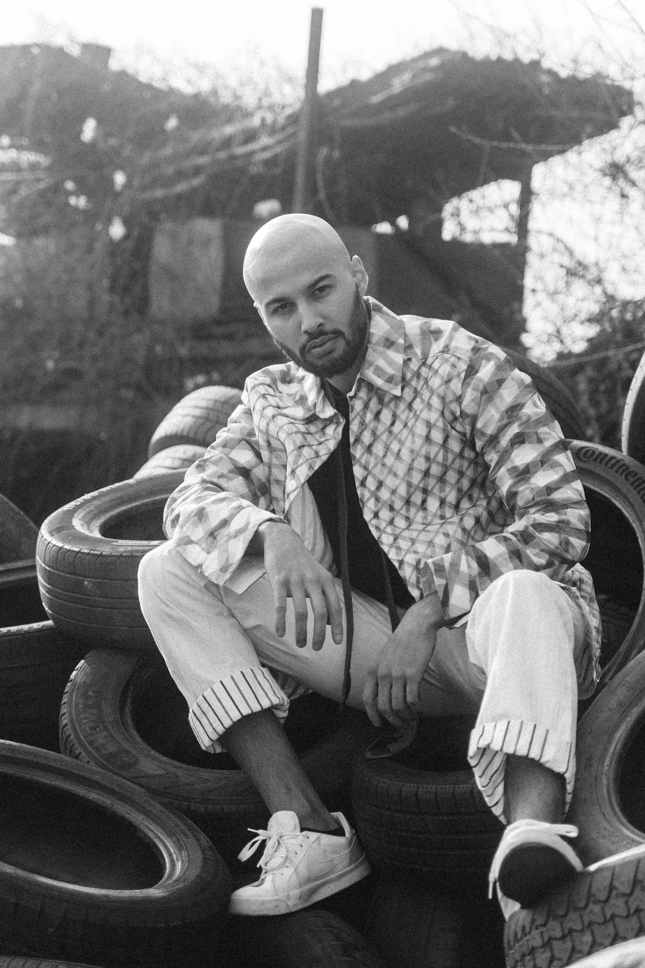 Portrait on a Tire Stack, Junkyard